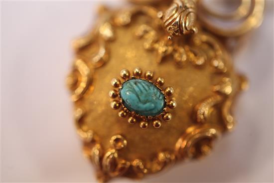 A Victorian gold and turquoise set heart shaped pendant locket, approx. 1.5in.